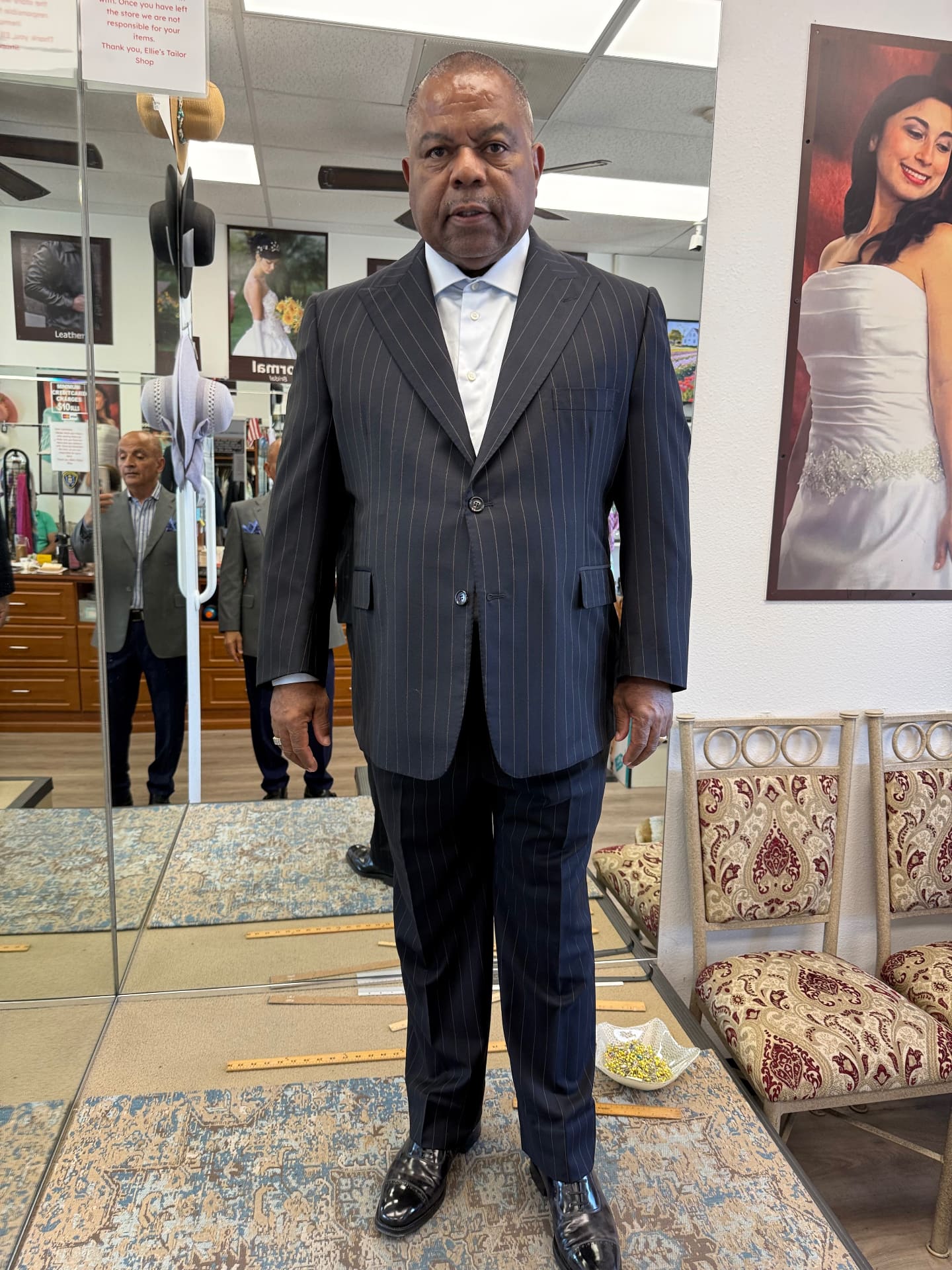 Wedding guest in a navy pinstripe two-piece bespoke suit