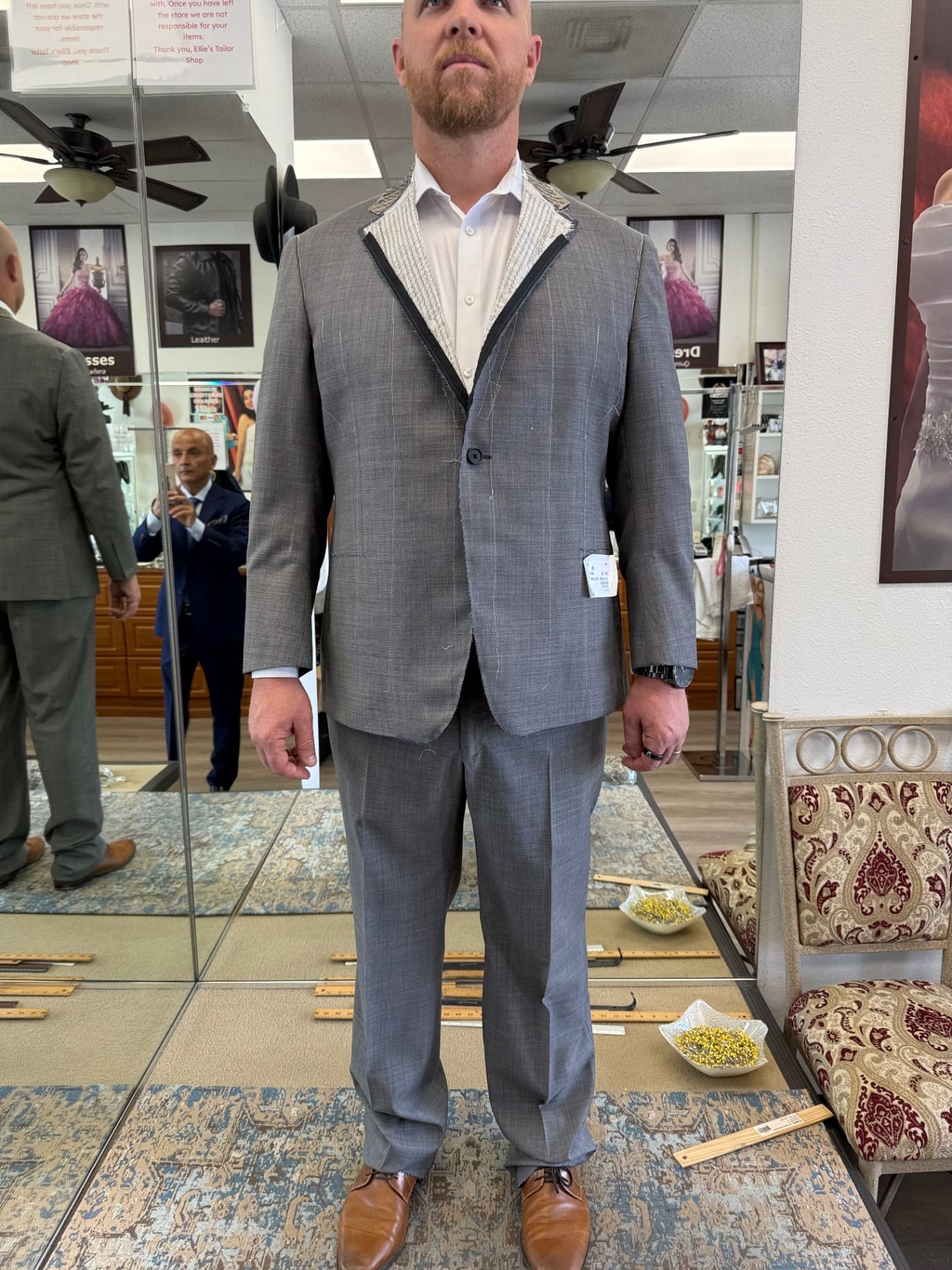 Wedding fitting of a gray plaid bespoke suit