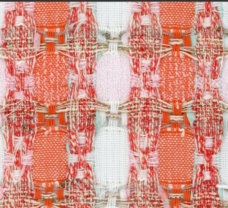 Coral, pink, and ivory bouclé fabric swatch